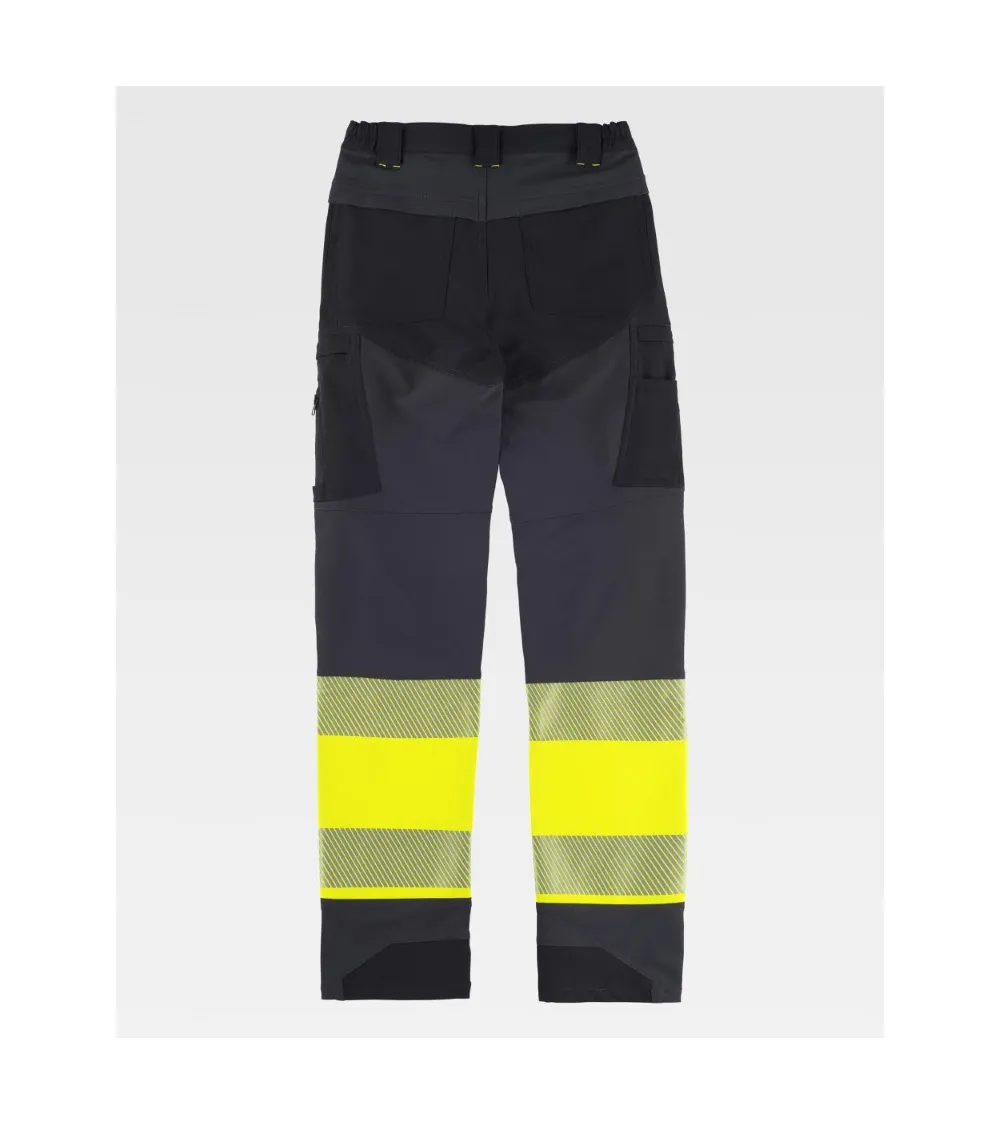 PANTALON TREKKING ALTA VISIBILIDAD GRIS AMARILLO EJEMPLO DE USO
